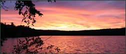 Pink sky and water sunset at Trout Lake Resort